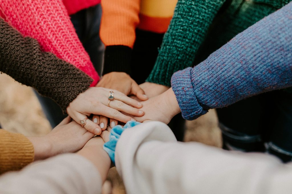 Hands of the senior caregivers' team are coming together, Photo by Hannah Busing Hands of the senior caregivers' team are coming together.